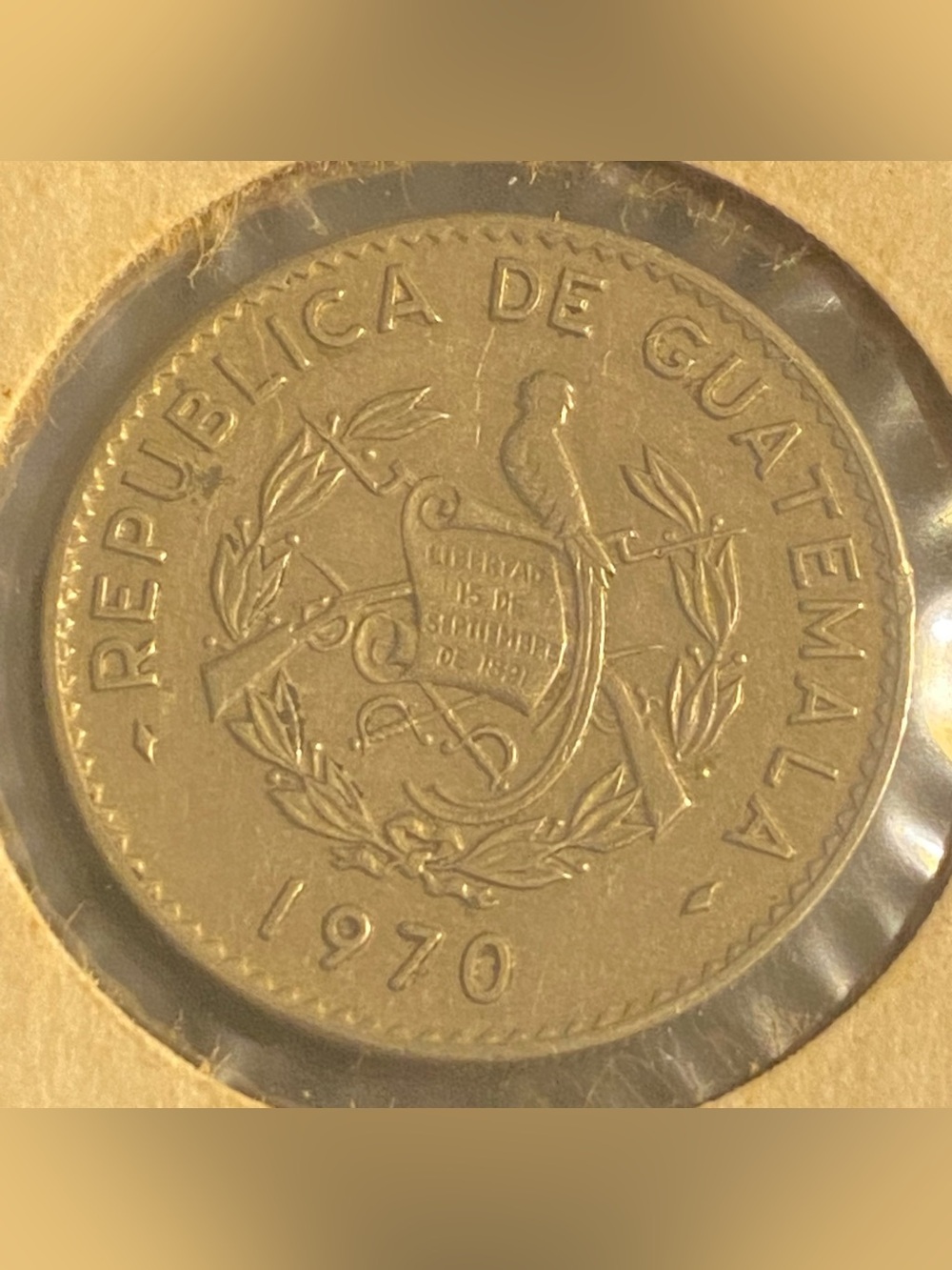 1970 Guatemala Centavo coin featuring the national coat of arms.